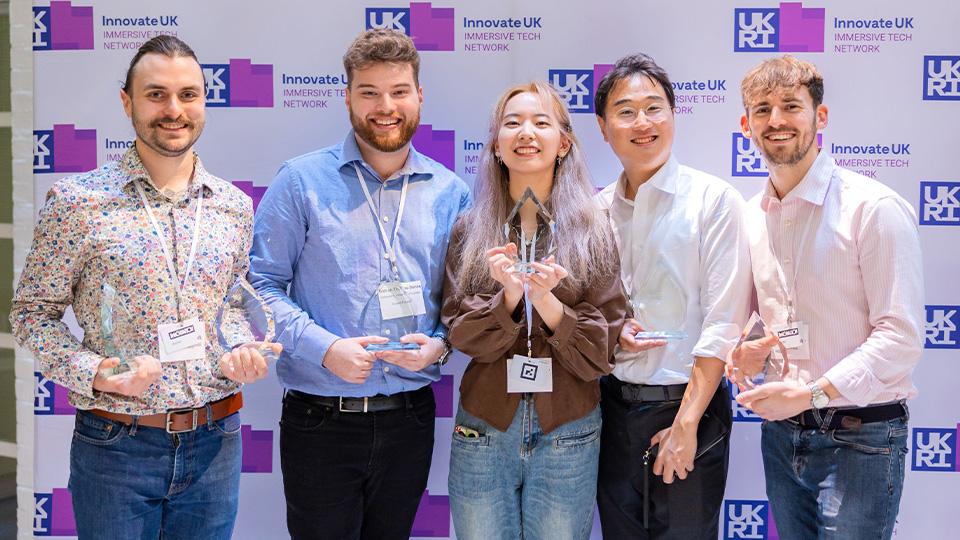 Students pose for a photograph after winning at Immersive Tech Awards